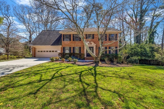 colonial-style house with a garage, driveway, a front lawn, and brick siding