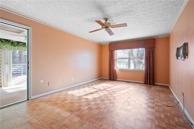 spare room with ceiling fan, a textured ceiling, and light parquet flooring