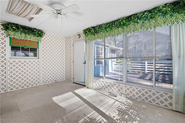 empty room with ceiling fan and carpet floors