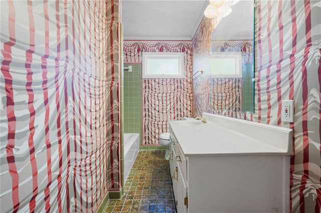 full bathroom with vanity, ornamental molding, shower / bathtub combination, and toilet