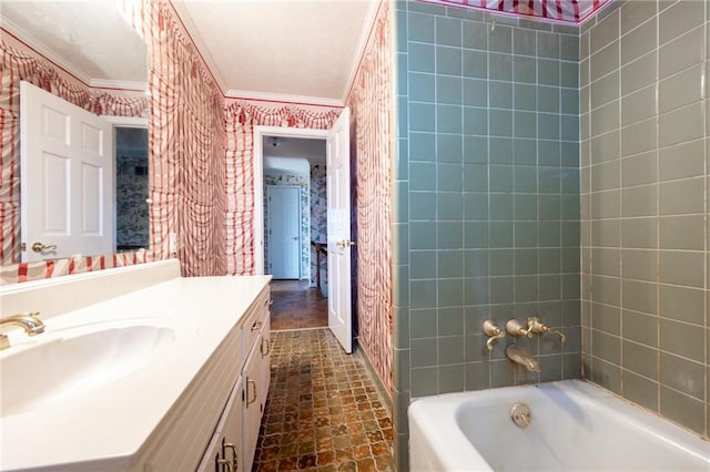 bathroom with vanity, ornamental molding, and shower / tub combination