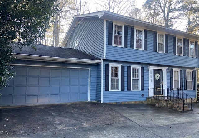 view of front of property featuring a garage