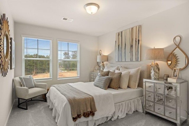 carpeted bedroom with visible vents