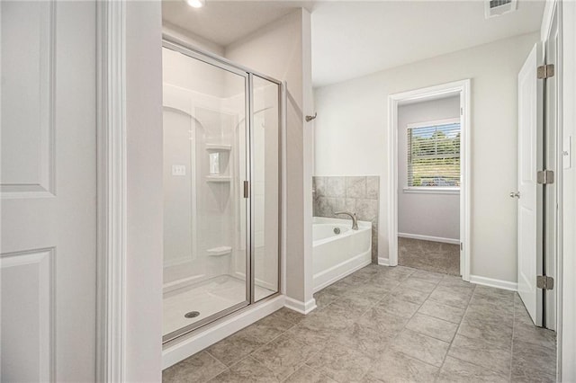 full bathroom featuring a shower stall, a bath, visible vents, tile patterned floors, and baseboards