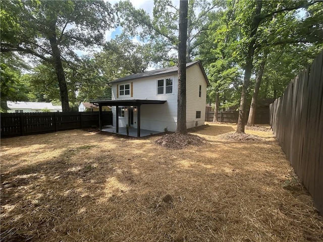5090 Lorraine Pl, Forest Park, GA 30297 - rear view of house with a patio area and a fenced backyard