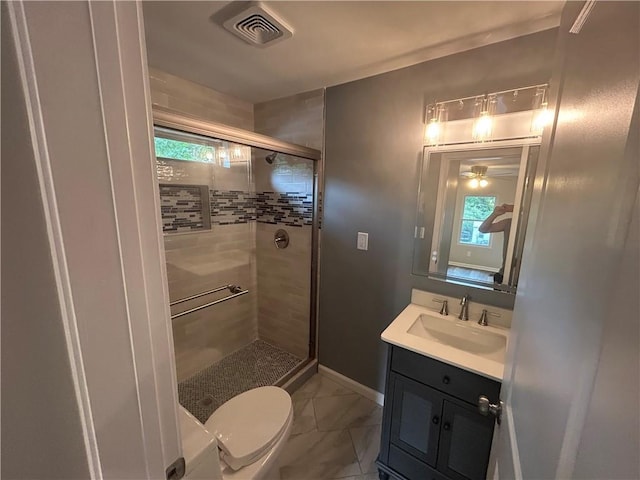 5090 Lorraine Pl, Forest Park, GA 30297 - full bath with a stall shower, toilet, vanity, and plenty of natural light