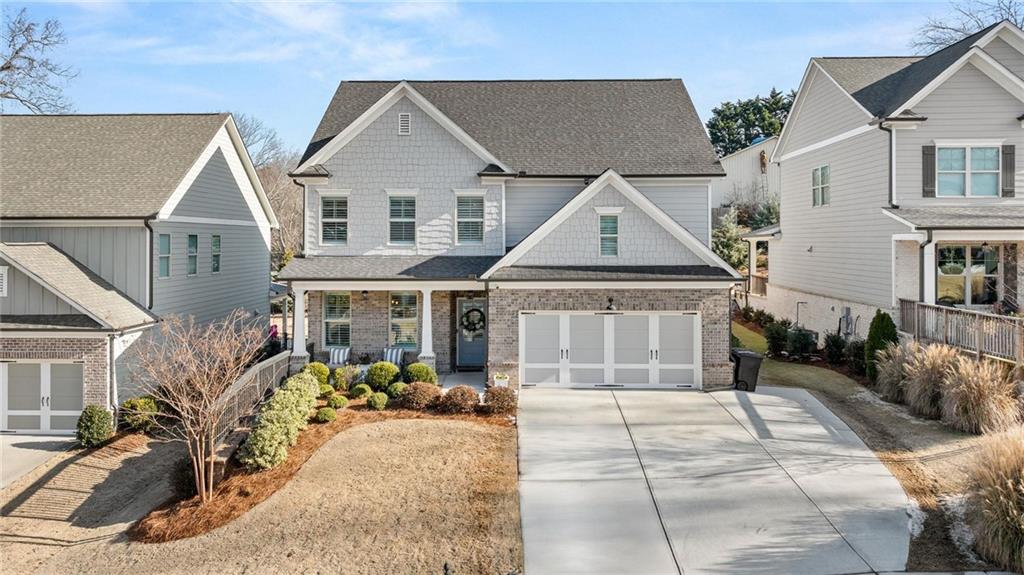 craftsman-style home featuring a garage and a porch