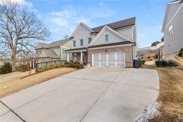 craftsman inspired home featuring covered porch and a garage