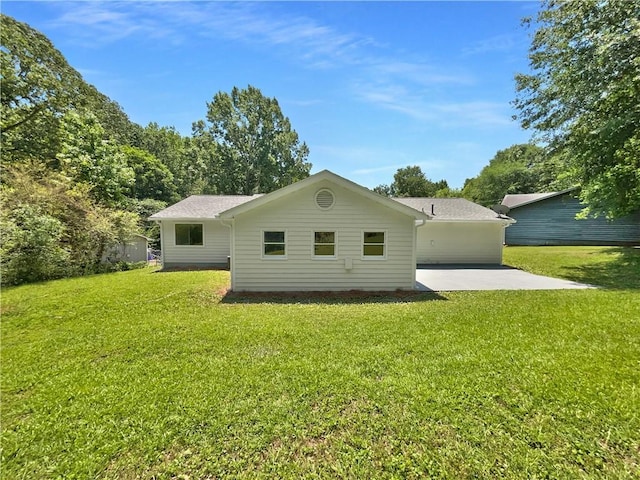 2492 Wild Rose Cir, Lawrenceville, GA 30044 - rear view of house featuring a patio and a lawn
