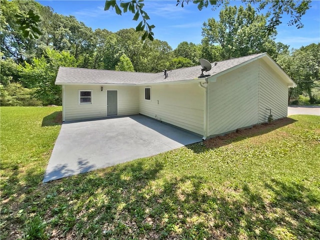 2492 Wild Rose Cir, Lawrenceville, GA 30044 - view of front of home with a front yard, a patio area, and a shingled roof