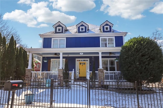 view of front of house featuring ceiling fan and a porch