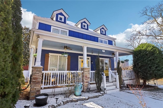 view of front facade featuring ceiling fan and covered porch