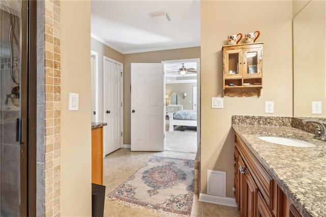 bathroom with vanity, tile patterned flooring, a shower with shower door, and ornamental molding