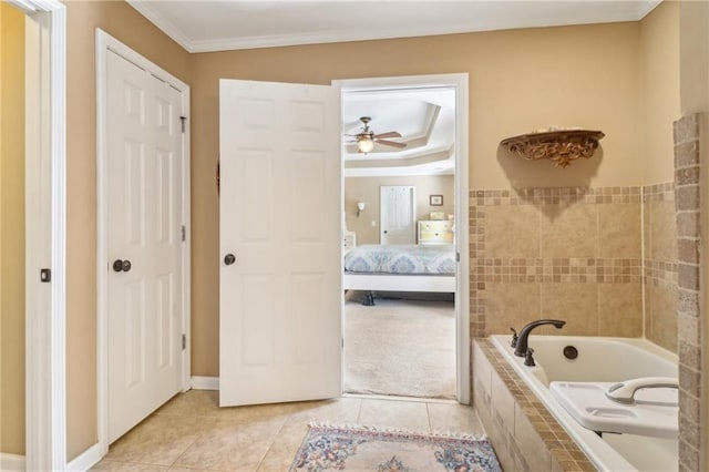 bathroom featuring a relaxing tiled tub, ceiling fan, ornamental molding, and tile patterned flooring