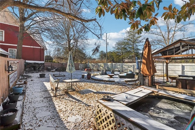 view of yard with a fire pit