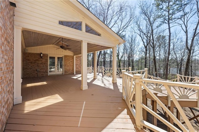 wooden deck featuring a ceiling fan and french doors