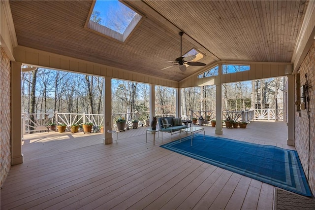 deck with ceiling fan and an outdoor hangout area