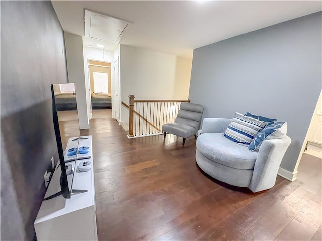 114 Garrison Dr, Winder, GA 30680 - sitting room with attic access, wood-type flooring, and an upstairs landing