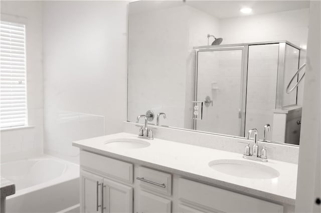 114 Garrison Dr, Winder, GA 30680 - full bath featuring a shower stall, a garden tub, and double vanity