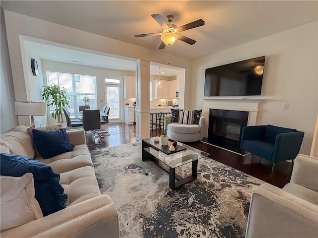 114 Garrison Dr, Winder, GA 30680 - living room featuring a ceiling fan, dark wood-style floors, and a glass covered fireplace