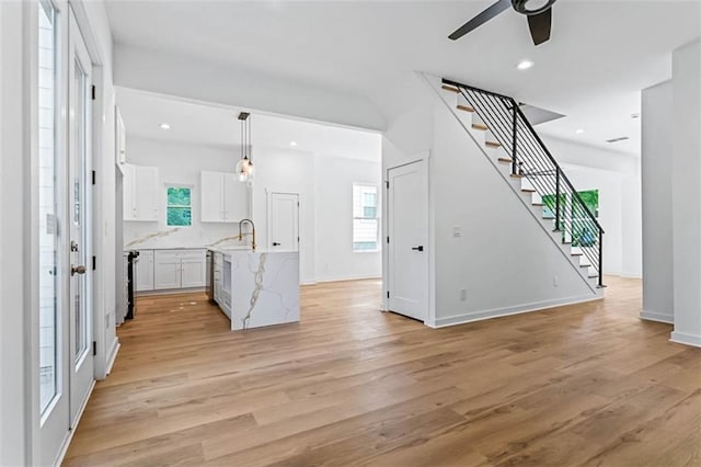 1835 Taylor Ave, East Point, GA 30344 - unfurnished living room featuring stairs, light wood-style flooring, ceiling fan, and recessed lighting
