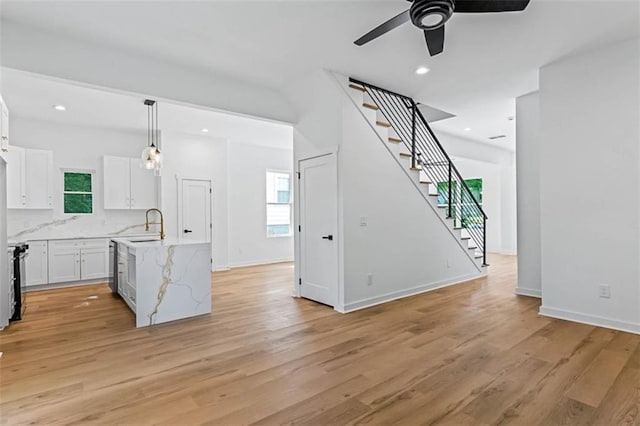 1835 Taylor Ave, East Point, GA 30344 - kitchen featuring ceiling fan, white cabinetry, healthy amount of natural light, light wood-style flooring, and recessed lighting