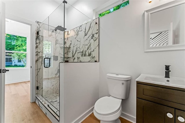 1835 Taylor Ave, East Point, GA 30344 - bathroom with plenty of natural light, vanity, a marble finish shower, and wood finished floors
