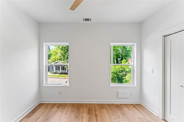 1835 Taylor Ave, East Point, GA 30344 - empty room with plenty of natural light, light wood finished floors, and a ceiling fan