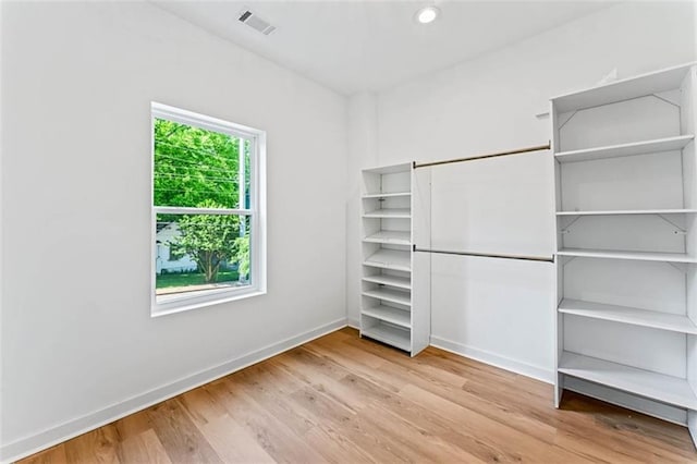 1835 Taylor Ave, East Point, GA 30344 - unfurnished bedroom with baseboards and wood finished floors