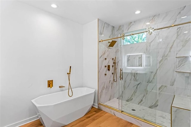1835 Taylor Ave, East Point, GA 30344 - bathroom featuring a soaking tub, wood finished floors, a marble finish shower, and recessed lighting