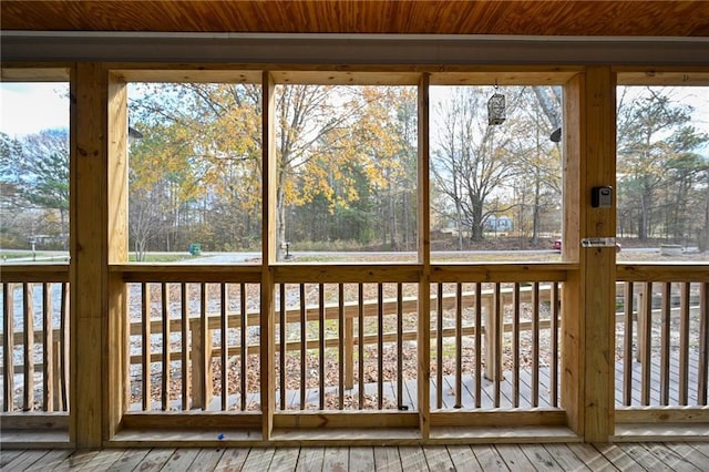 unfurnished sunroom featuring wooden ceiling