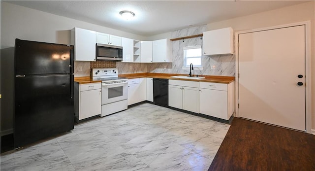 kitchen with open shelves, backsplash, white cabinetry, a sink, and black appliances