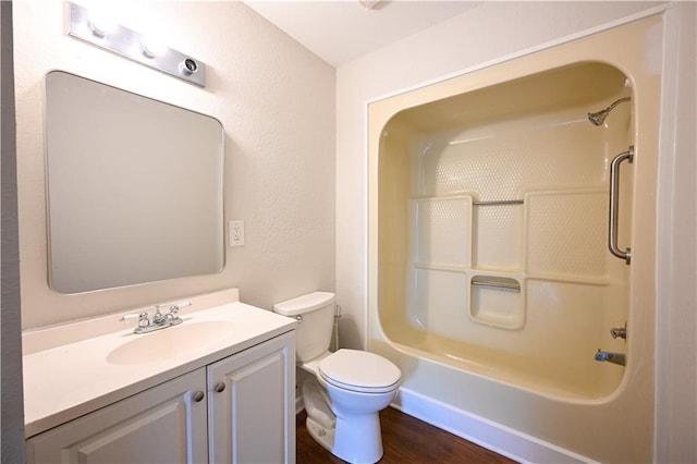 full bathroom featuring shower / bathing tub combination, vanity, wood-type flooring, and toilet