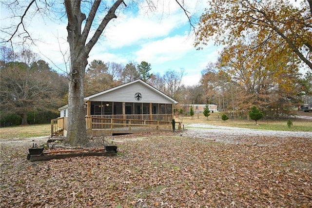 view of front facade with a sunroom