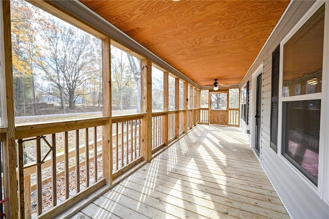 unfurnished sunroom featuring wood ceiling