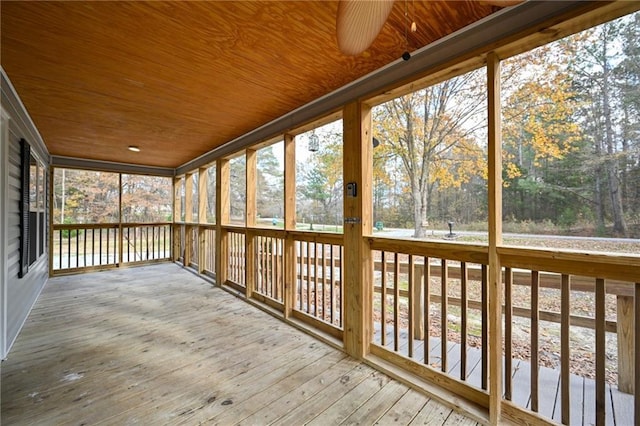 unfurnished sunroom featuring wooden ceiling