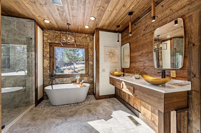 bathroom featuring wooden walls, vanity, shower with separate bathtub, and wooden ceiling