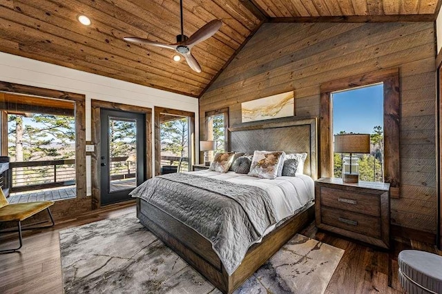 bedroom with access to exterior, wooden walls, high vaulted ceiling, dark hardwood / wood-style flooring, and wooden ceiling