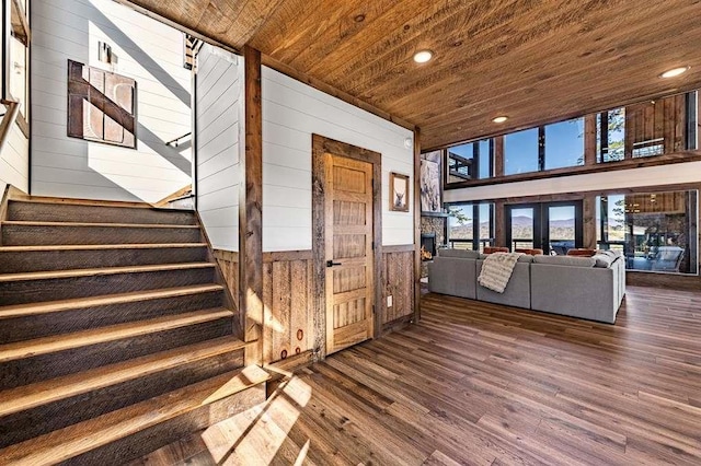 interior space featuring wood ceiling, wood-type flooring, and wood walls