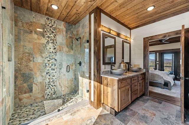 bathroom with vanity, wood ceiling, and a shower with door