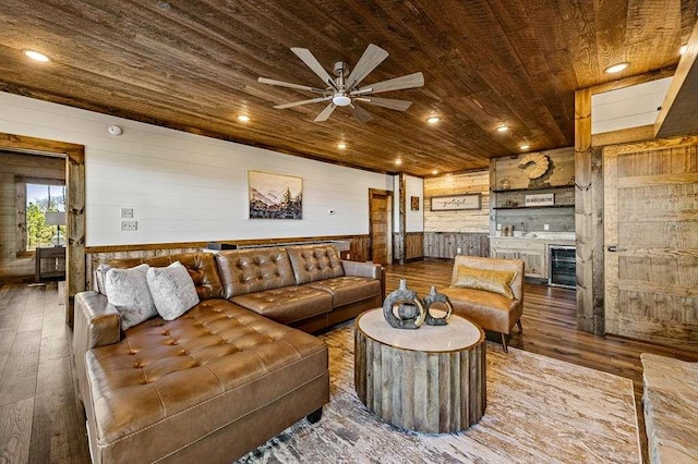 living room featuring wine cooler, indoor bar, hardwood / wood-style flooring, and wooden ceiling