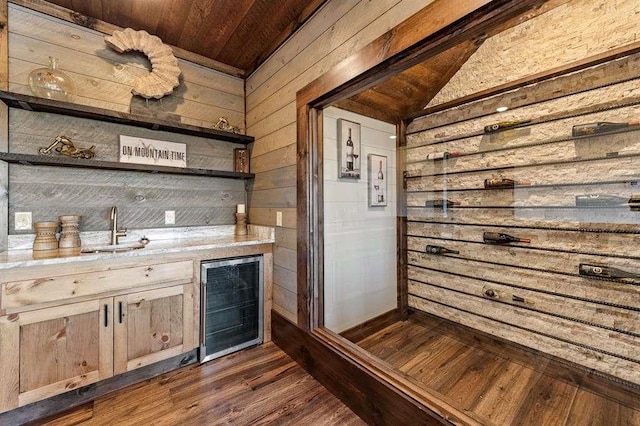 bar with lofted ceiling, sink, wine cooler, dark hardwood / wood-style flooring, and wood ceiling