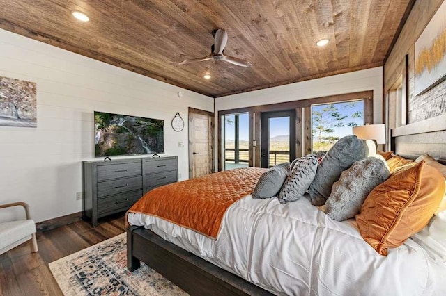 bedroom with dark hardwood / wood-style floors, wooden walls, access to outside, ceiling fan, and wood ceiling