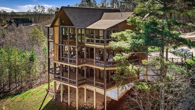 rear view of house with a sunroom