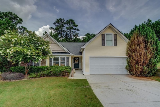 view of front property with a garage and a front lawn