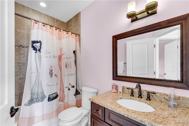 bathroom featuring toilet, a shower with curtain, and vanity