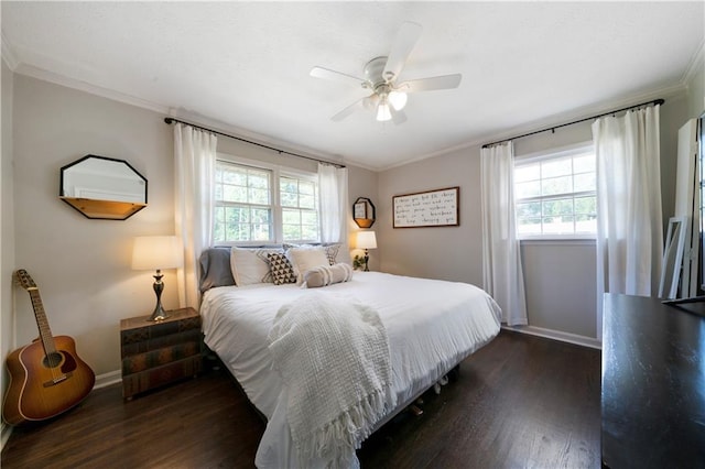 bedroom featuring multiple windows, crown molding, dark hardwood / wood-style floors, and ceiling fan