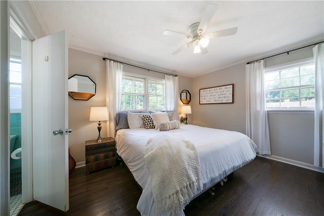 bedroom with ornamental molding, dark hardwood / wood-style floors, and ceiling fan