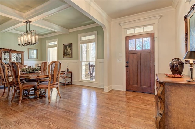 103 Old Avery Dr, Canton, GA 30115 - foyer entrance featuring light wood finished floors, beamed ceiling, a chandelier, wainscoting, and crown molding
