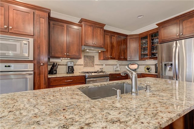 103 Old Avery Dr, Canton, GA 30115 - kitchen featuring stainless steel appliances, under cabinet range hood, a sink, glass insert cabinets, and tasteful backsplash